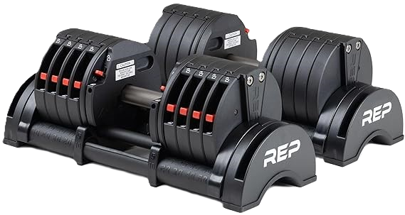 REP adjustable dumbbells on a home gym floor